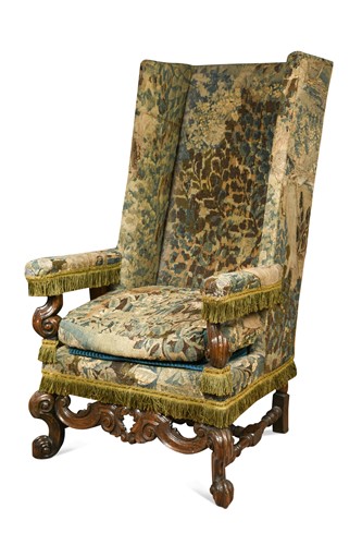 Lot 9 - A Carolean carved walnut  and oak needlework upholstered wingback armchair, 17th century