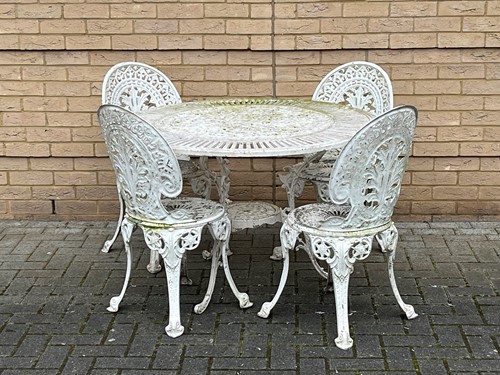 Lot 597 - A modern painted metal garden table and 4...