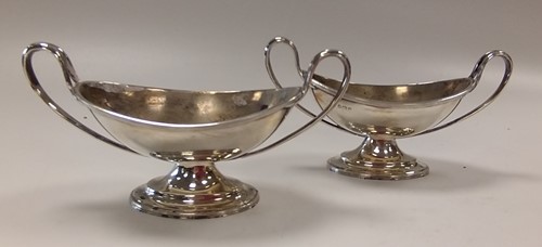 Lot 218 - A pair of silver boat shaped two handled salts,...