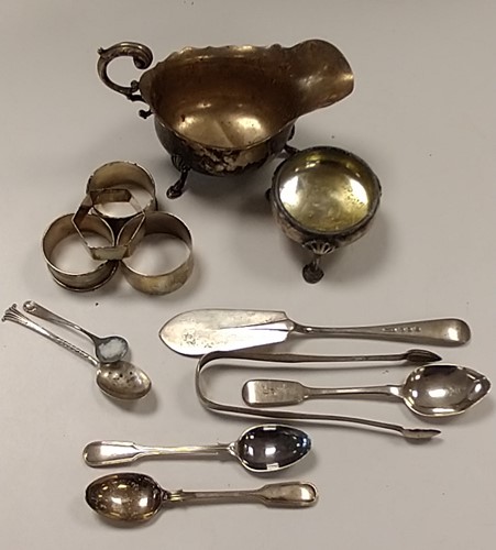 Lot 216 - A collection of silverware including napkin...