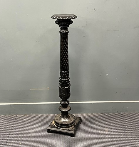 Lot 575 - An ebonised pedestal, 20th century, the...