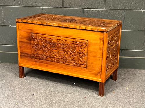 Lot 588 - An Arts & Crafts relief carved wood coffer,...