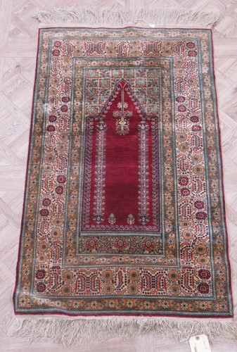 Lot 613 - A vintage 'silk' prayer rug 140 x 74cm
