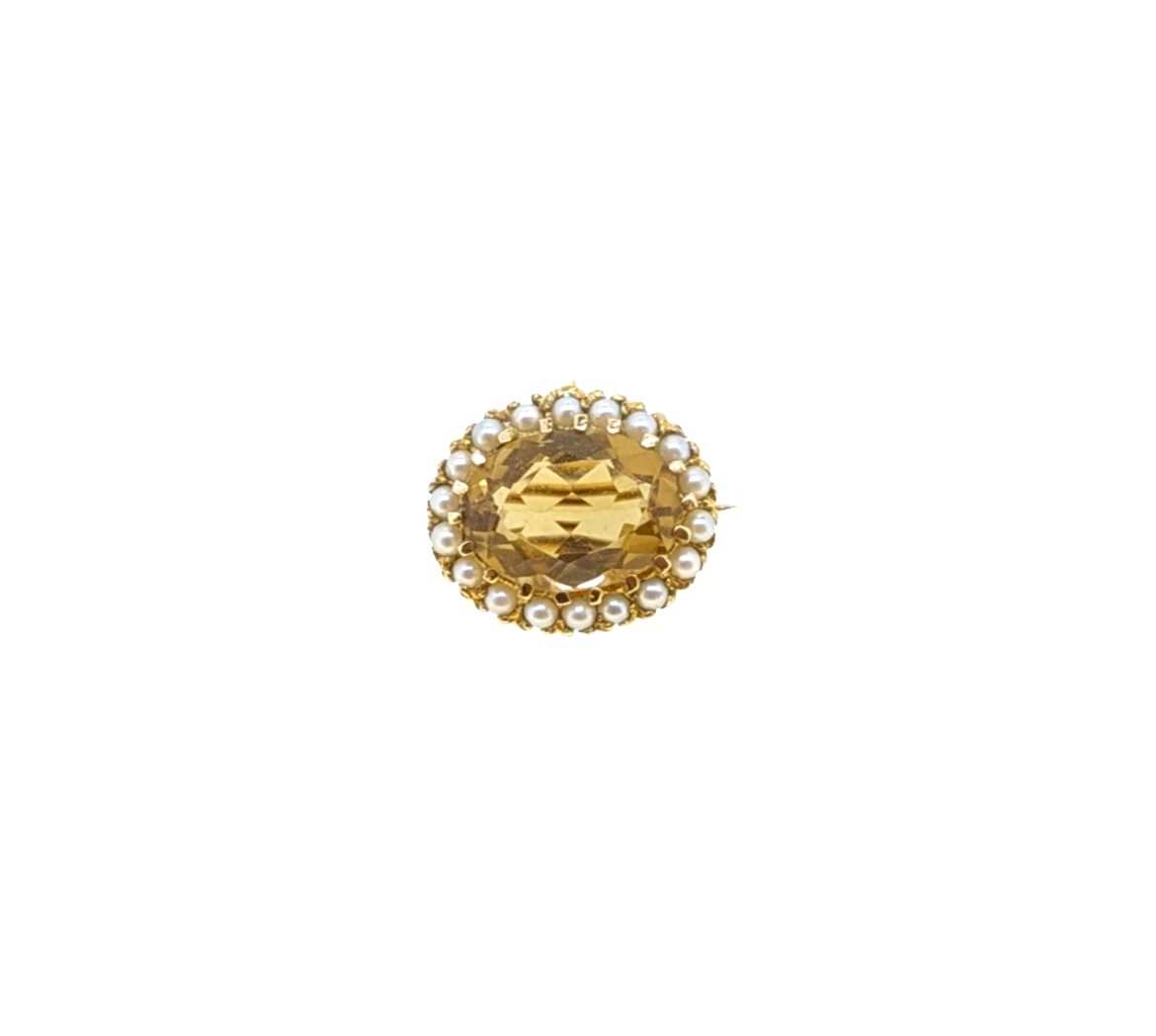 Lot 7 - A citrine and pearl target style brooch