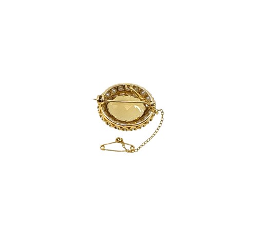 Lot 7 - A citrine and pearl target style brooch