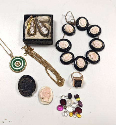 Lot 205 - A jade pendant on a hallmarked 9ct gold chain,...