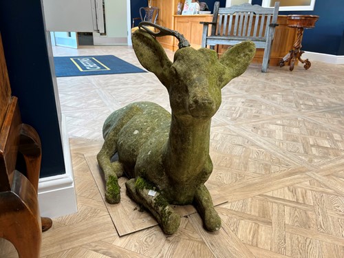 Lot 598 - A composition garden figure of a recumbent...