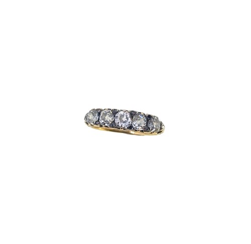 Lot 123 - A diamond set carved half hoop style ring