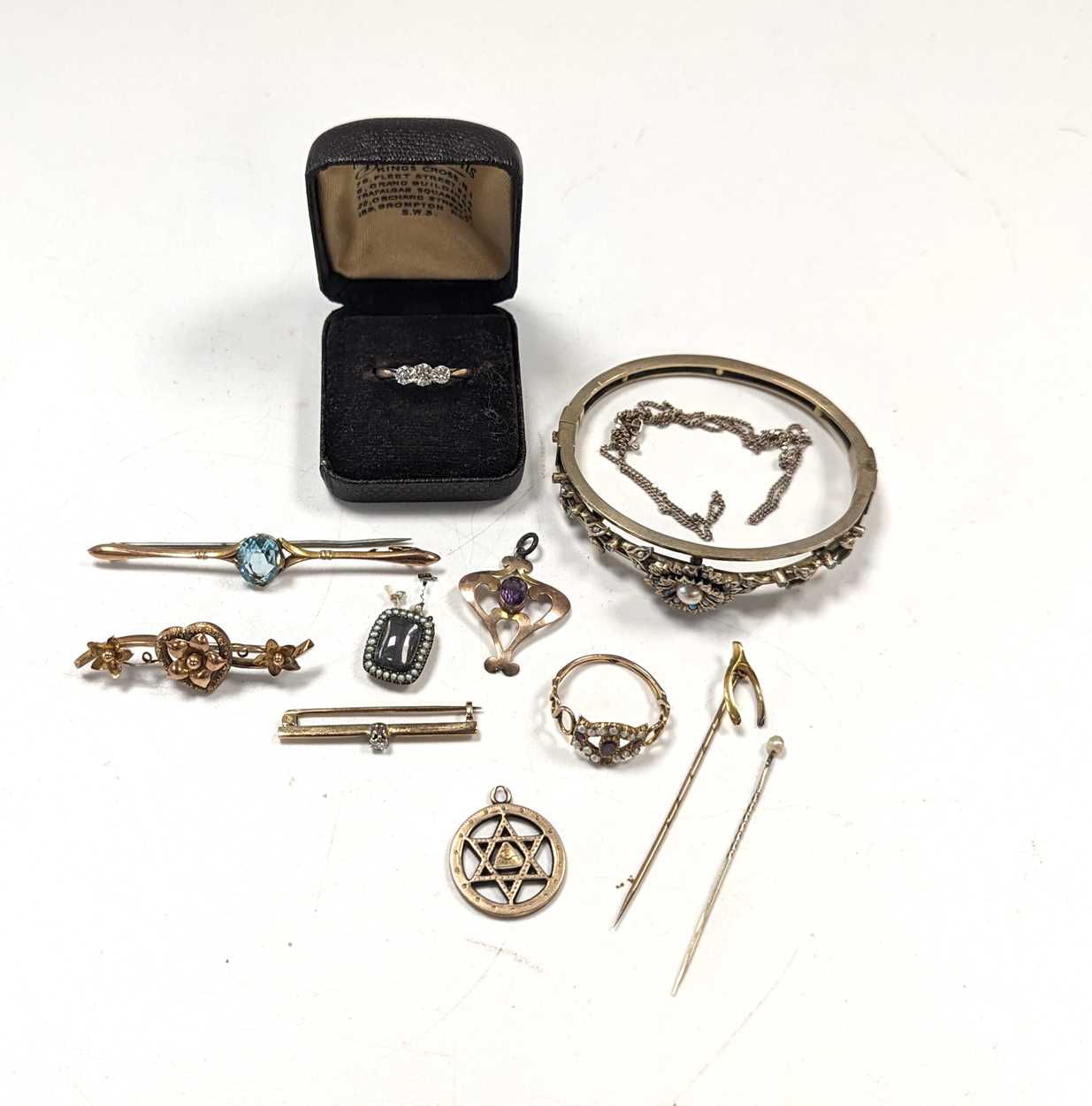 Lot 192 - A three stone diamond ring, stamped '9CT