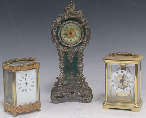 Lot 21 - Two brass carriage clocks and a stained green...