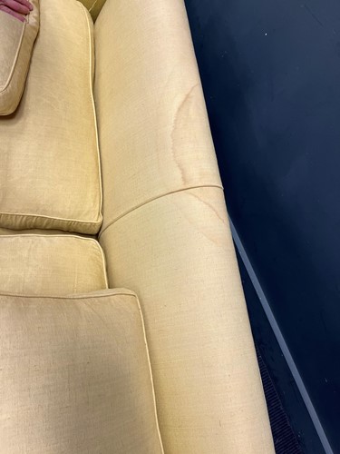 Lot 634 - A yellow sofa with fringe