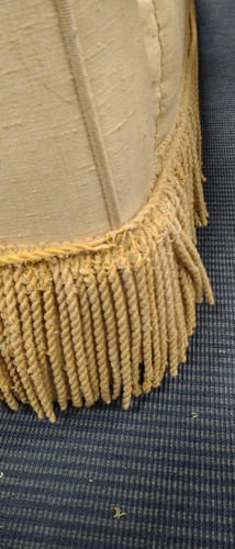 Lot 634 - A yellow sofa with fringe