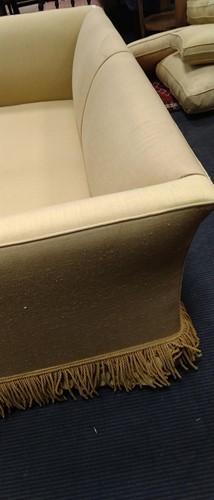 Lot 634 - A yellow sofa with fringe