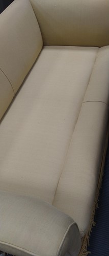 Lot 634 - A yellow sofa with fringe