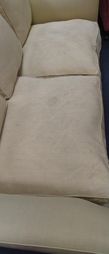 Lot 634 - A yellow sofa with fringe