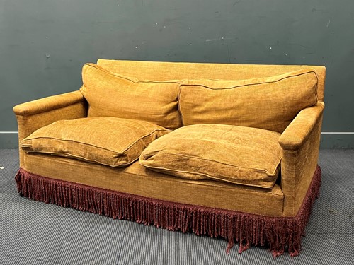 Lot 616 - A modern two seat sofa, the deep rust coloured...