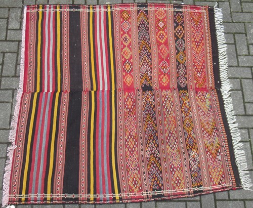 Lot 493 - A flat weave tribal rug formed of two joined...