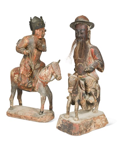 Lot 46 - A pair of painted wood equestrian figures, possibly late Ming