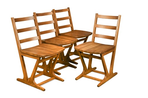 Lot 202 - A set of four Ensign elm dining chairs, circa 1960