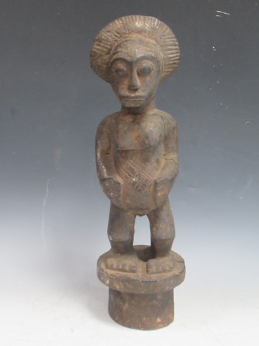 Lot 255 - A West African carved wood figure, probably...