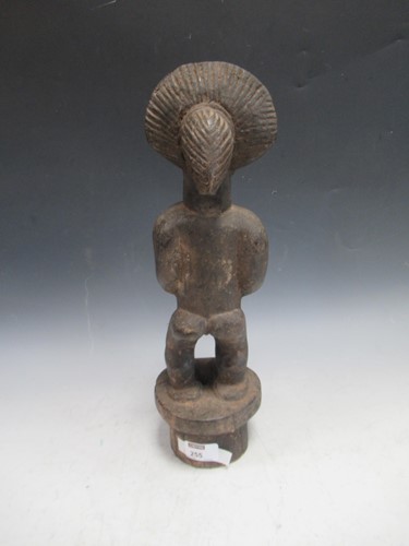 Lot 255 - A West African carved wood figure, probably...