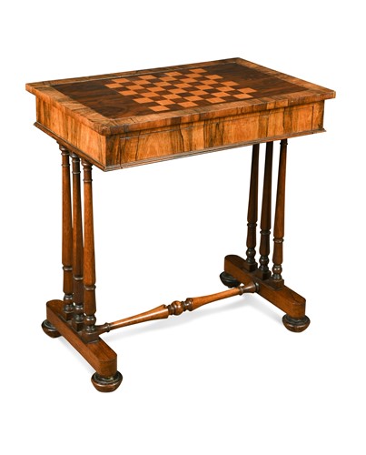 Lot 601 - A Victorian inlaid rosewood games table