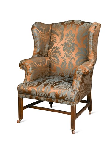 Lot 448 - A matched pair of George III style mahogany wingback armchairs