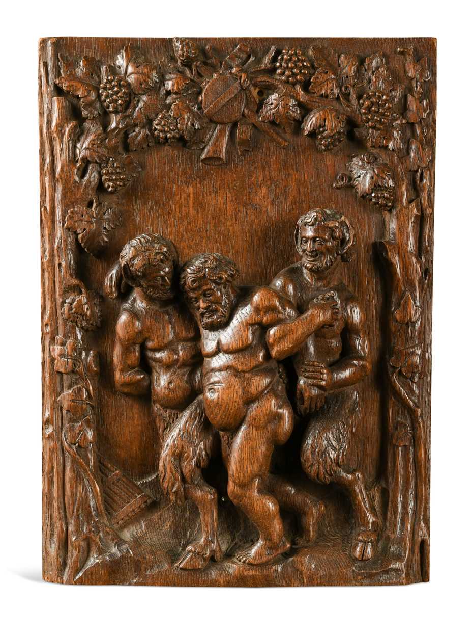 Lot 510 - A relief carved oak wall plaque of a Bacchic scene, 19th century