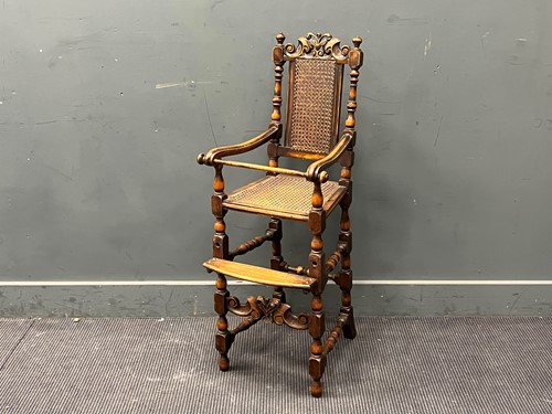 Lot 388 - A Carolean style childs high chair with caned...