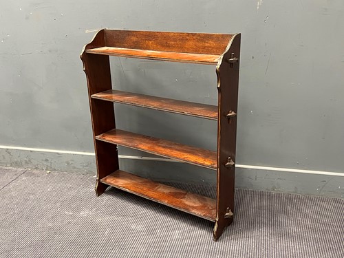 Lot 384 - An early 20th century open oak bookcase, with...