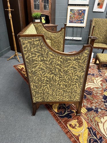 Lot 157 - In the manner of Walter Frederick Cave (1863-1939), an Arts & Crafts high-back settee