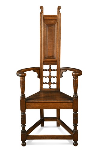 Lot 161 - Attributed to William Bartlett for Liberty & Co., an oak Shakespeare Chair