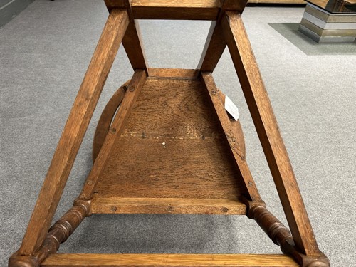 Lot 161 - Attributed to William Bartlett for Liberty & Co., an oak Shakespeare Chair