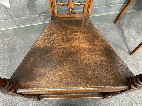 Lot 161 - Attributed to William Bartlett for Liberty & Co., an oak Shakespeare Chair