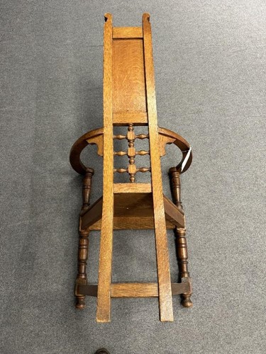 Lot 161 - Attributed to William Bartlett for Liberty & Co., an oak Shakespeare Chair