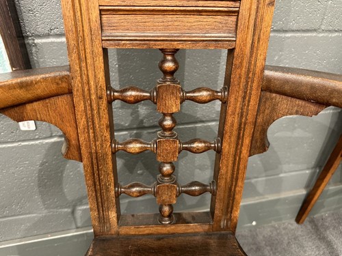 Lot 161 - Attributed to William Bartlett for Liberty & Co., an oak Shakespeare Chair