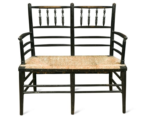 Lot 148 - Attributed to Morris & Co., an ebonised wood two-seat settle