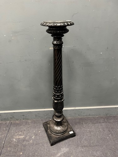 Lot 470 - An ebonised pedestal, 20th century, the...
