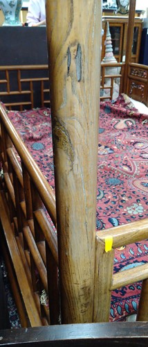 Lot 296 - A Chinese carved elm wood wedding bed, late Qing Dynasty