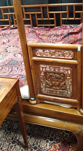 Lot 296 - A Chinese carved elm wood wedding bed, late Qing Dynasty