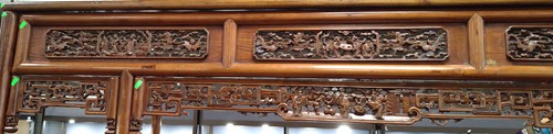 Lot 296 - A Chinese carved elm wood wedding bed, late Qing Dynasty