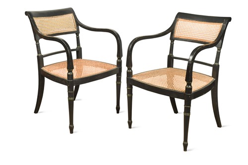 Lot 569 - A pair of Regency ebonised armchairs, stamped for John Gee