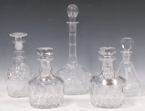 Lot 249 - A pair of circular form cut glass decanters...