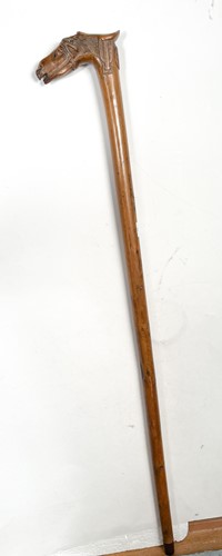 Lot 743 - A Greek carved olive wood walking cane, late 19th century
