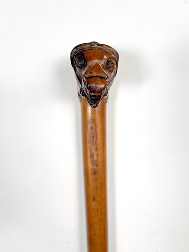 Lot 743 - A Greek carved olive wood walking cane, late 19th century