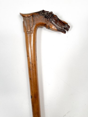 Lot 743 - A Greek carved olive wood walking cane, late 19th century