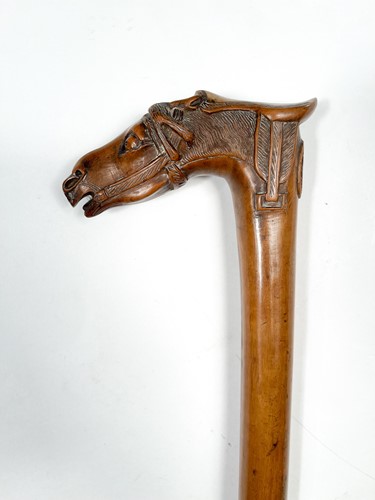 Lot 743 - A Greek carved olive wood walking cane, late 19th century