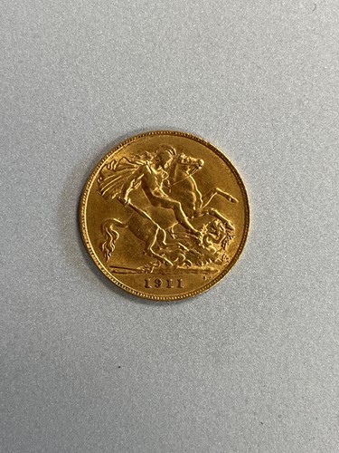 Lot 219 - A small collection of coins, including a gold...