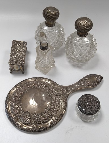 Lot 207 - A silver hand mirror, a pair of silver topped...