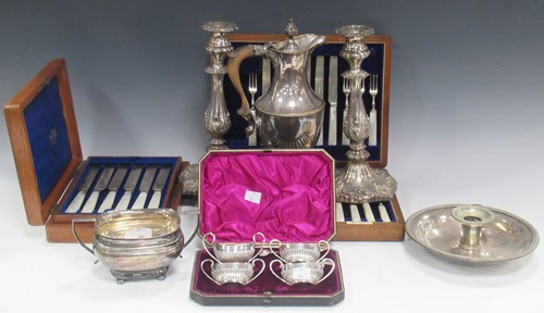 Lot 381 - A pair of plated candlesticks with floral and...